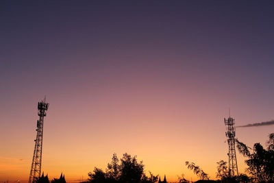 Low angle view of silhouette trees against sky during sunset