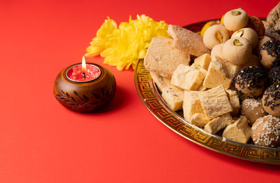 High angle view of food in bowl on yellow background