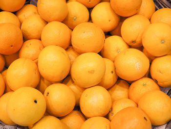 Full frame shot of oranges at market stall
