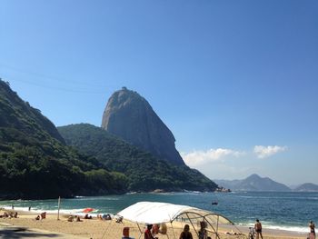 Scenic view of beach against blue sky