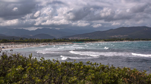 Scenic view of sea against cloudy sky