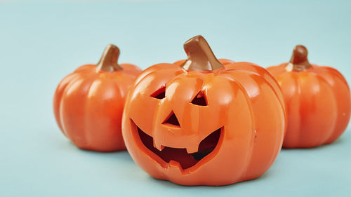 Close-up of pumpkin against orange background
