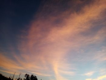 Low angle view of cloudy sky during sunset