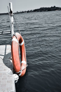 Rope hanging on boat in sea