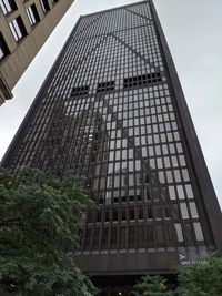 Low angle view of modern building against sky