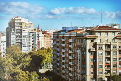 Buildings in city against sky