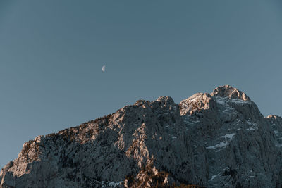 Low angle view of rock formation against clear sky