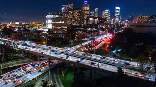 High angle view of illuminated buildings in city at night,los angeles drone view of downtown skyline