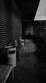 Empty chairs against wall in building