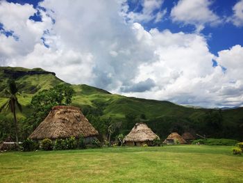 Scenic view of landscape against cloudy sky