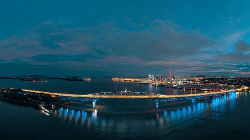 Illuminated city at waterfront