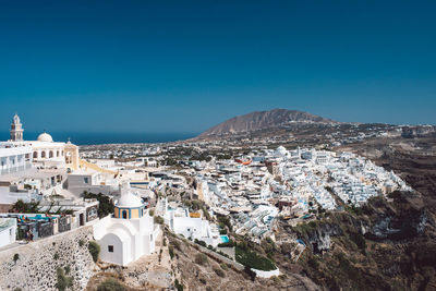 High angle view of townscape against clear blue sky