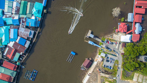 High angle view of swimming pool by buildings in city