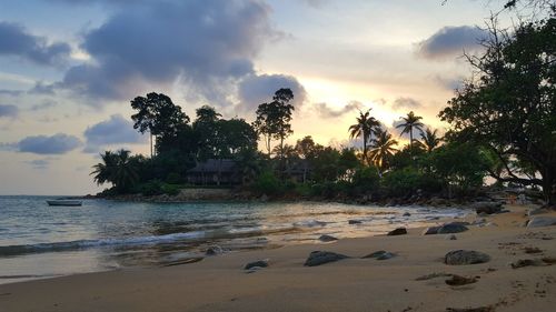 Scenic view of beach against sky during sunset