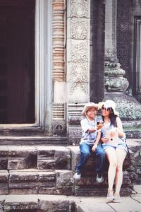 Happy mother and son taking selfie at angkor wat