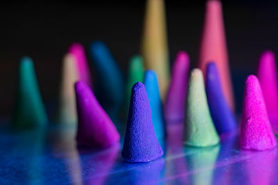 Close-up of multi colored pencils against black background