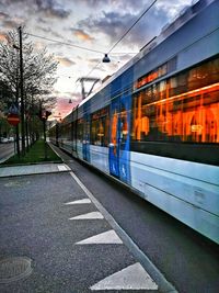 Train at railroad station against sky