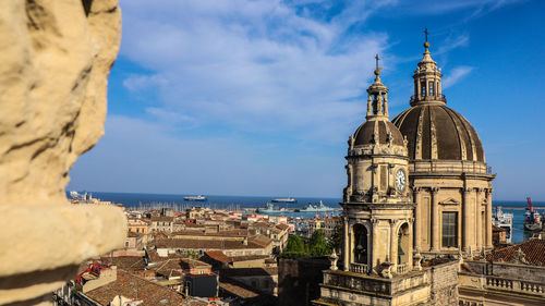 Panoramic view of buildings in city against sky