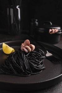 Black spaghetti with cuttlefish ink with octopus