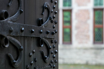 Close-up of metal door of building