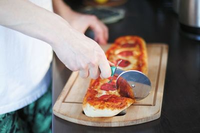 Midsection of man preparing food