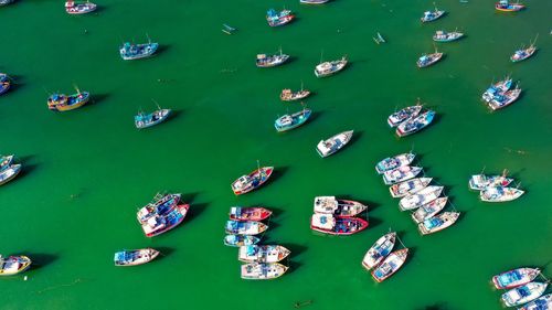 Aerial view of boats moored in lake