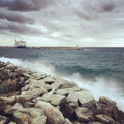 Scenic view of sea against cloudy sky