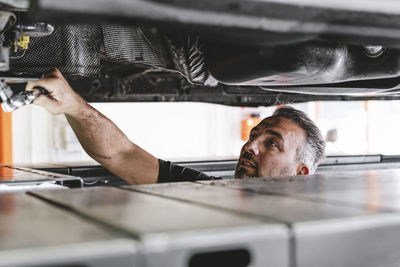 Man repairing car