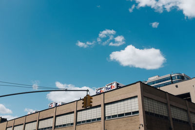 Low angle view of buildings against blue sky