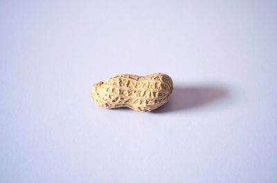 High angle view of bread on table against white background