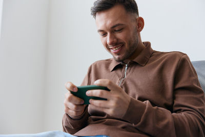 Young man using mobile phone