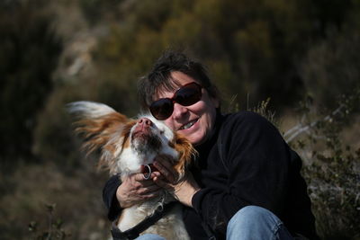 Smiling woman with dog