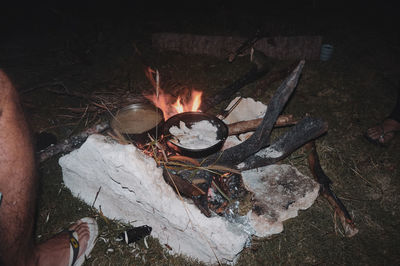 High angle view of woman burning on wood