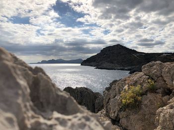 Scenic view of sea and rocks against sky