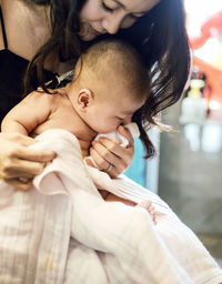 Close-up of mother holding baby