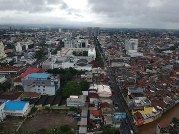 High angle view of buildings in city against sky