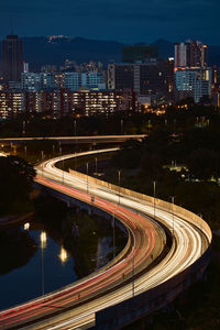 High angle view of light trails on road at night