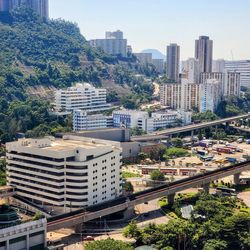 High angle view of buildings in city against sky
