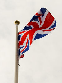 Low angle view of flag against sky