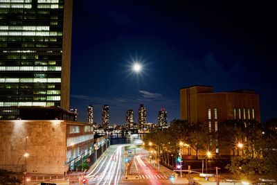 Light trails on road in city at night