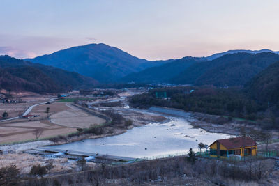 Scenic view of landscape and mountains against sky