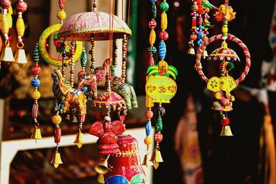 Close-up of decorations hanging for sale at market