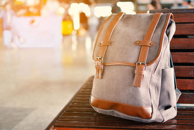 Close up of backpack on a wooden bench