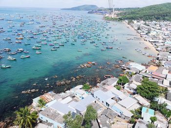 High angle view of sailboats and sea in city