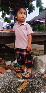 Cute boy standing outdoors