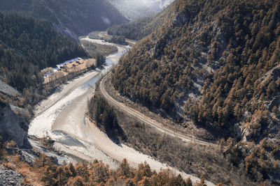 High angle view of road amidst mountains