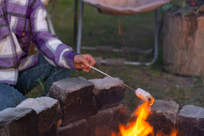 Midsection of man preparing food