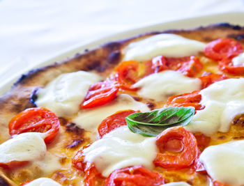 Close-up of pizza served in plate