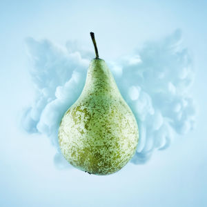 Close-up of fruit over white background