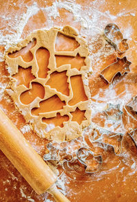 Directly above shot of various shapes on gingerbread dough